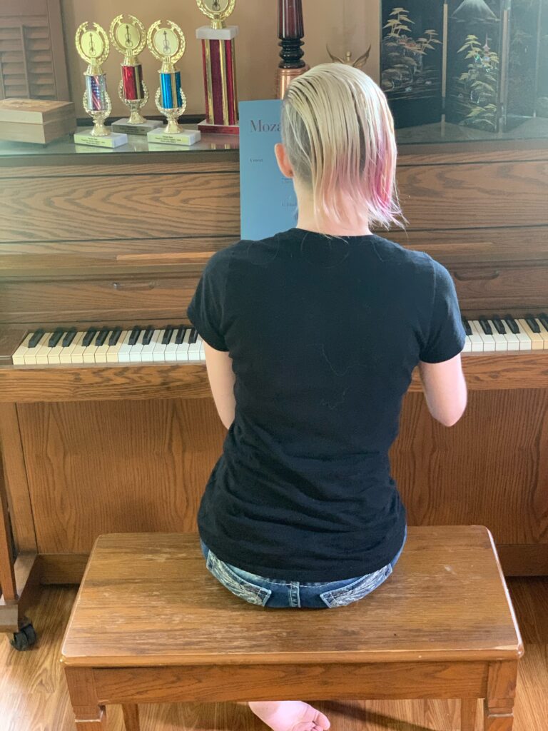student at piano